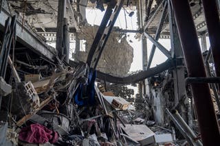Mangled structural beams are seen amid remains of a residential building in the Saadat Abad neighbourhood of Tehran that was struck by an Israeli attack on June 13